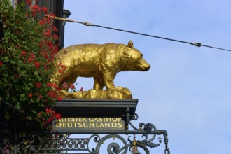 Golden bear sculpture and sign, Germany's oldest inn, Freiburg im Breisgau, Black Forest,