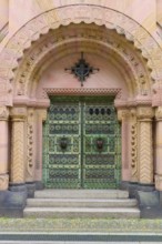 Entrance to the Archbishop's Ordinariate of Freiburg, historic ornate door under a decorative round