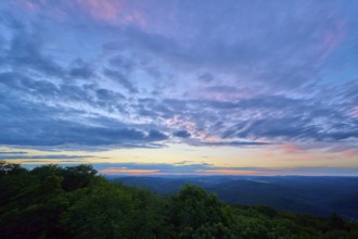 Twilight sky with purple and blue clouds over the landscape, Katzenbuckel, Waldbrunn,