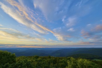 Pink and blue clouds over a tree landscape, sunset, Katzenbuckel, Waldbrunn, Neckar-Odenwald-Kreis,