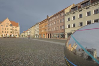 Historic houses with mood lighting on the market square, metal sphere with reflection, Cranachhof,
