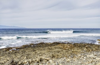 View over a rocky coast to calm broken waves, Tenerife, Canary Islands