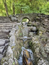 A small stone bridge over the Brühlbach, wild and romantic stream and source of the Urach waterfall