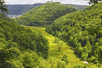 Magnificent view from the rock of the Urach waterfall into the wide Maisental valley with a green