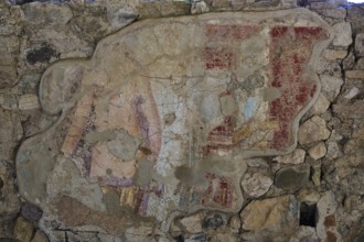Weathered ancient mural shows fragments of colours and details, Archaeological Site, House of