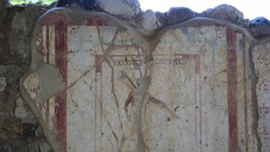 Damaged ancient fresco with pale colours and cracks in a ruin, Archaeological site, Messenger,