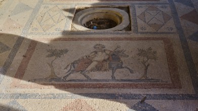 Ancient mosaic depicting a man and a horse surrounded by geometric patterns, House of Beluga