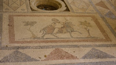 Ancient mosaic with figures and geometric patterns, showing people and a horse, Archaeological