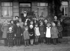 Group of children Father Christmas, 1930, Group of children with a disguised Father Christmas in