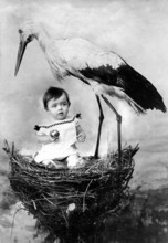 Baby nest stork, 1920, Child sitting in a stork's nest next to a stork in a surreal scene,