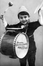 Child drum, 1920, Boy with drum and birthday wishes in a cheerful depiction, historical photo