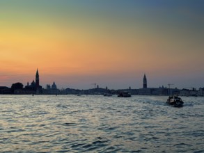 View over the lagoon to Venice at sunset, lagoon city of Venice, Veneto, Italy