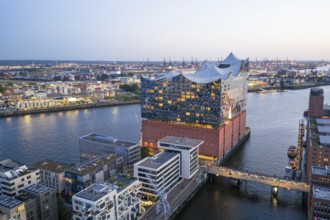Aerial view of the Elbphilharmonie at blue hour with harbour and Elbe in the background, Hamburg,