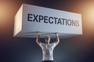 Man straining under block labeled expectations with work gloves, symbolizing male gender roles and