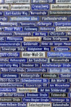 Compact collection of blue street signs with numerous street names, Amorbach, Odenwald, Bavaria,
