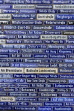 Blue street signs with a variety of names, Amorbach, Odenwald, Bavaria, Germany