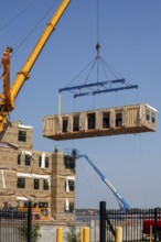 Detroit, Michigan - Workers use modular construction methods to build apartments for low to