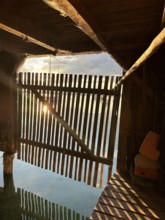 View from a boathouse onto Lake Starnberg at sunset, Bavaria, Germany