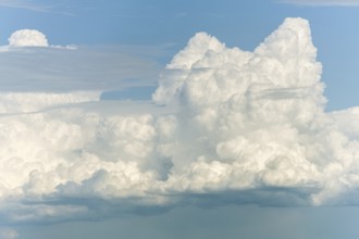 A large cloud in the sky. The sky is blue. The cloud is white.Bas rhin, Alsace, grand est, France