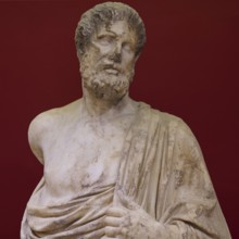 Close-up of the marble statue of a bearded man with distinctive facial features, Archaeological