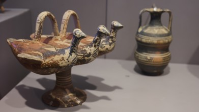 Ceramic vessel with triple bird's head design, artistically decorated, Archaeological Museum, Kos