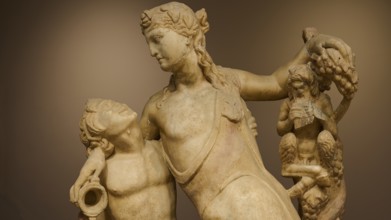Close-up of the upper parts of an ancient sculpture, with figures and vines, Archaeological Museum,