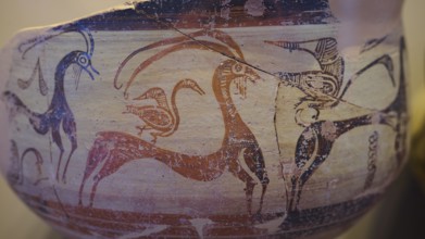 Antique vase with geometric art motifs of goats and birds in red and beige, Archaeological Museum,