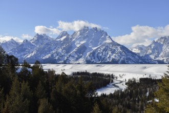 View over the Snake River... Teton Range (Rocky Mountains) in winter with snow, down in the valley