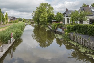 Damsterdiep canal in the village of ten Post, province of Groningen, Netherlands