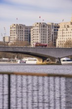 Urban scene on the river with a bridge, buildings and a bus, London, United Kingdom, World