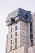 Partially finished high-rise building under construction with modern architectural design, London,