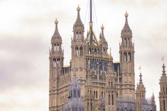 Detailed view of Gothic towers of a historically important building in the evening light, London,