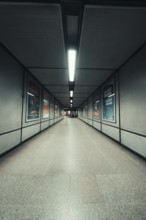 Long, illuminated corridor with minimalistic wall decoration, London, United Kingdom
