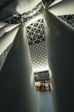 Close-up of girders and pillars in a modern hall with interesting lighting conditions, King's Cross