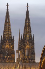 Evening atmosphere, Cologne Cathedral illuminated with LED lamps and the Hohenzollern Bridge,