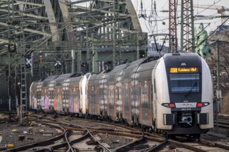 Rail system in front of Cologne Central Station, Hohenzollern Bridge across the Rhine, RRX,