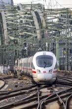 Rail track in front of Cologne Central Station, Hohenzollern Bridge across the Rhine, ICE