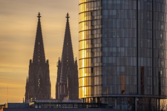 Cologne Cathedral, church towers, round façade of the Cologne Triangle Hochaus in Cologne-Deutz,