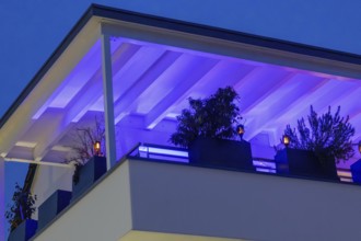Modern roof terrace with atmospheric LED lighting in changing colors