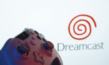 Dhaka, Bangladesh- 24 Mar 2025: A close-up of a gamepad with the Dreamcast seen on screen in the