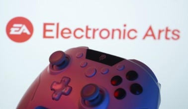 Dhaka, Bangladesh- 24 Mar 2025: A close-up of a gamepad with the Electronic Arts seen on screen in