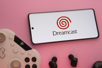 Dhaka, Bangladesh- 08 Apr 2025: A smartphone displaying the Dreamcast logo next to a gaming