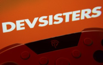 Dhaka, Bangladesh- 24 Mar 2025: A close-up of a gamepad with the Devsisters seen on screen in the