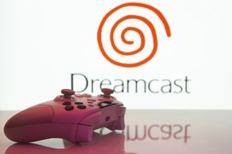 Dhaka, Bangladesh- 20 Mar 2025: A close-up of a white gamepad with the Dreamcast seen on screen in