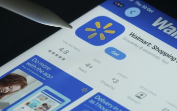 Dhaka, Bangladesh- 30 Oct 2025: Walmart app on a iPad screen with a pen pointing at the install