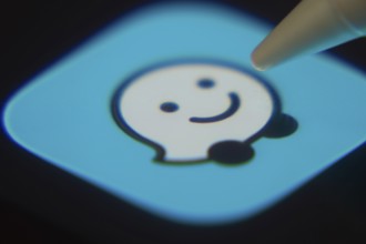 Dhaka, Bangladesh- 06 Dec 2025: Close-up of the Waze app on a screen with a stylus pointing at it