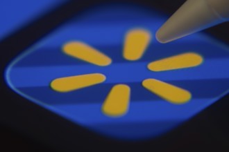 Dhaka, Bangladesh- 06 Dec 2025: Close-up of the Walmart app on a screen with a stylus pointing at