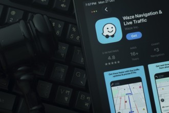 Dhaka, Bangladesh- 28 Oct 2025: An iPad displaying the Waze app against a judge's gavel and dark