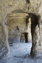 Weathered cave interior with uneven stone walls, cave town Uplistsikhe, Inner Kartli region, Shida
