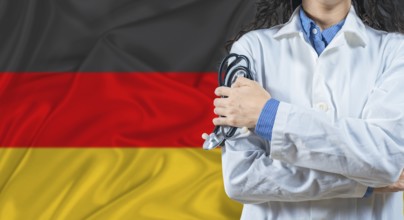 Healthcare professional with Germany flag background. Professional doctor holding stethoscope on